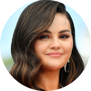 Selena Gomez smiling in headshot outdoors