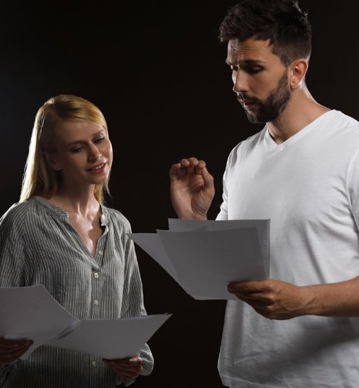 actor and coach going over script