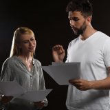 actor and coach going over script