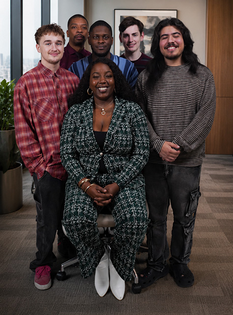 Motion Picture Program Spring 2026 graduates sitting and standing together in a room