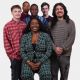 Motion Picture Program Spring 2026 graduates sitting and standing together on a plain white background